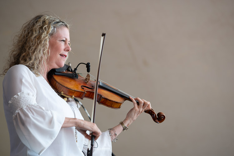 A portrait of Natalie MacMaster and her fiddle.