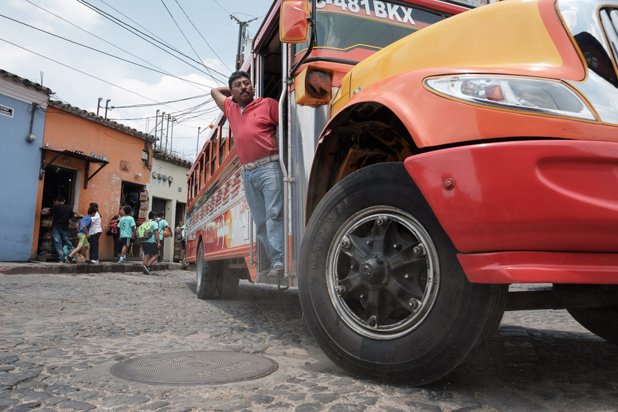 All aboard the chicken bus out of town! These decked out buses are color-coded to indicate their routes as many people can&rsquo;t read in the rural regions of Guatemala where they run.