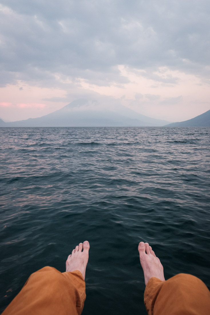 Clarineros fly home on the horizon in the last light on Lake Atitlán.