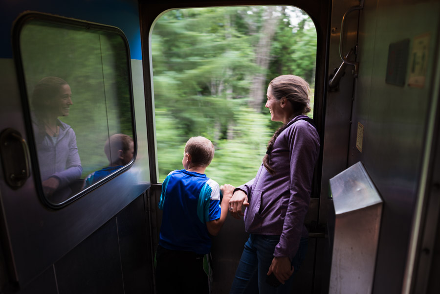 A happy mother and son lean out train window enjoying the ride. Our train was only four cars long: an engine car, luggage car, passenger car, and dining car. For the bulk of our two day journey from Jasper to Prince Rupert, there were only half a dozen of us as passengers. With Diane&rsquo;s encouragement, it was nice to relax and enjoy the ride in ways that you certainly couldn&rsquo;t on the main line.