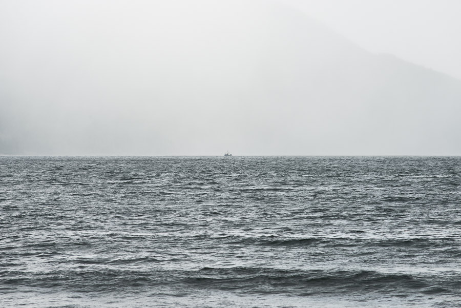 A distant sailboat in rainy Rennell Sound. Most people access this remote area by boat rather than by road, and I can&rsquo;t say I blame them.