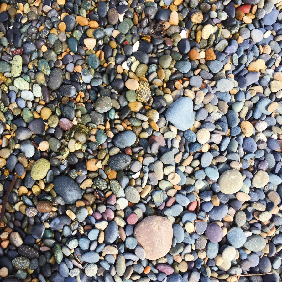 The colorful pebbles of Agate Beach. This is the most northerly shore of the Haida Gwaii and the relentless waves that are so popular with surfers polish its rocks to a smooth finish.