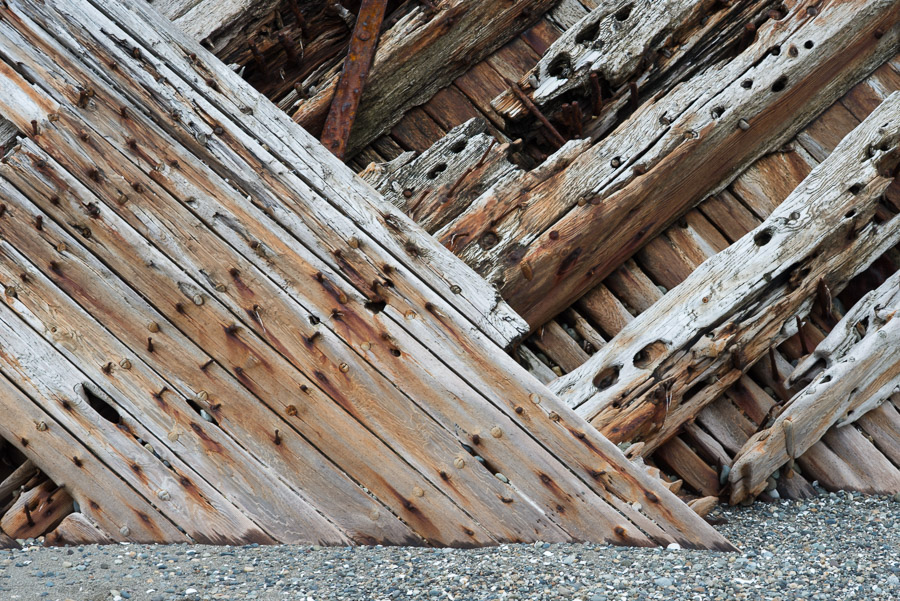 Dodging the huge tidal range, we hiked up the beach to find the worn relic of a shipwreck stuck deep in rocky beach. The image is stark: felled trees of the forest we just walked through are taken to suit human purposes, but eventually it always returns to the earth.