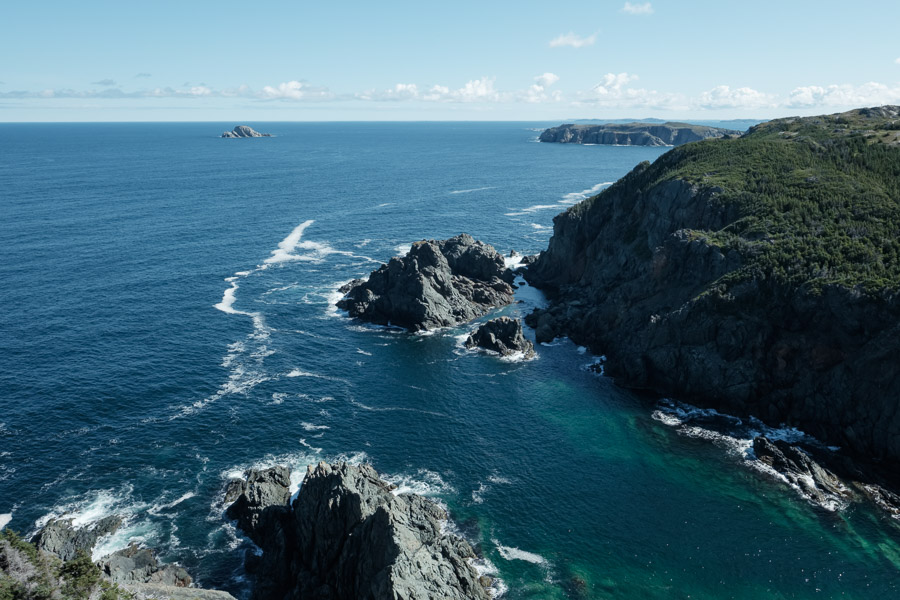 A rugged coast of endless rocky inlets and bays.