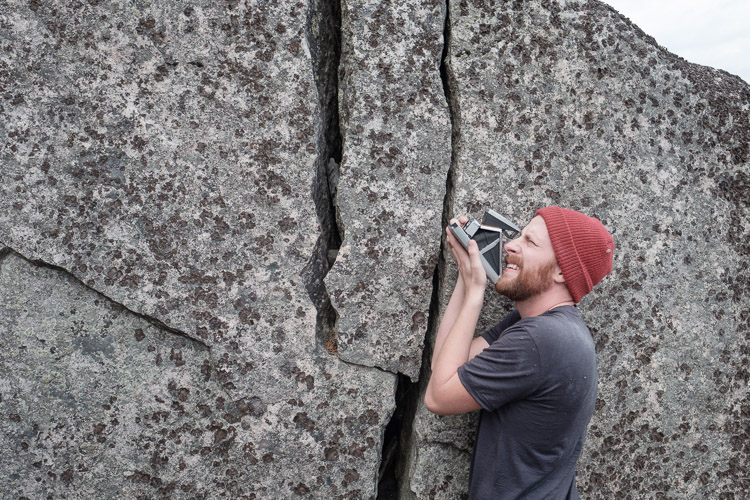 Fellow photographer Daniel Crump having fun with his classic Polaroid camera.