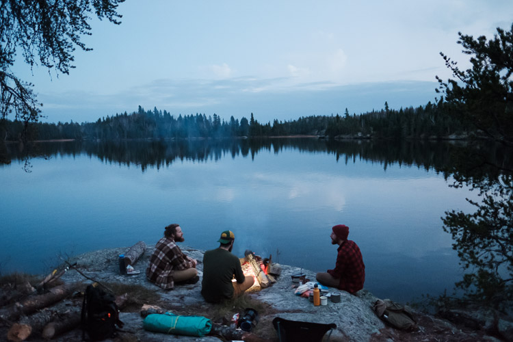 Watching the stars come out while gathered around the fire.