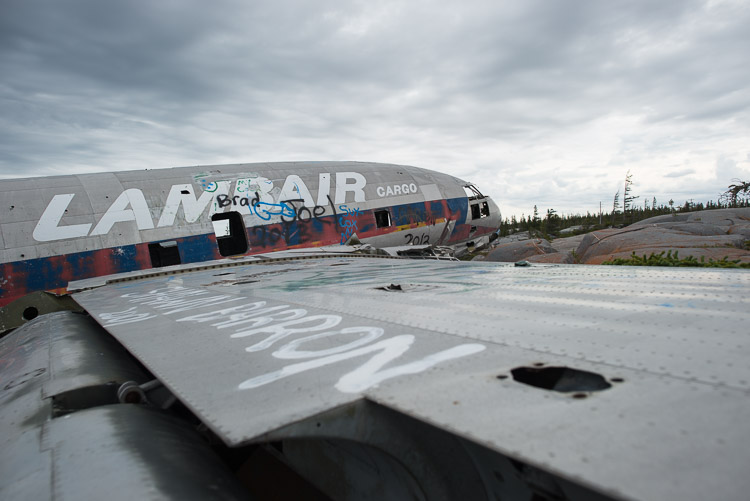 The wreckage itself. Miss Piggy, the nickname for this downed plane, is a C-46 aircraft that crashed on November 13th, 1979. She was flying a cargo of 1 ski-doo and many cases of pop from Churchill to Chesterfield Inlet when the left engine lost oil pressure.