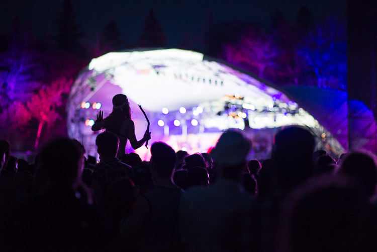 A dancer is silhouetted against stage lights&hellip;