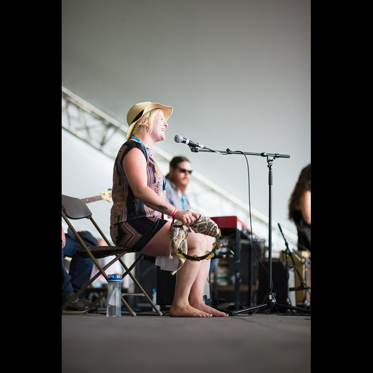 Karli Colpitts sings with all her heart, backing up her brother, The Reverend Rambler.
