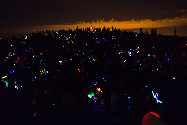 The heart of the nighttime festivities center around Pope&rsquo;s Hill. Covered with people, it glows in the darkness of night.