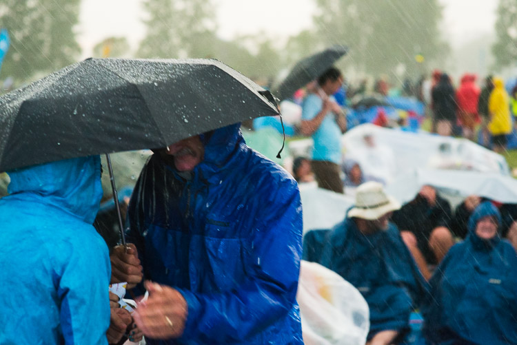The rain comes heavy and hard. People seek shelter, uncertain whether the storm will pass as quickly as it materialized.